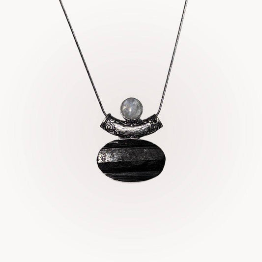 Moonstone & Black Tourmaline Pendant with raw-front Tourmaline and polished Moonstone in silver bezel for protection and intuition.