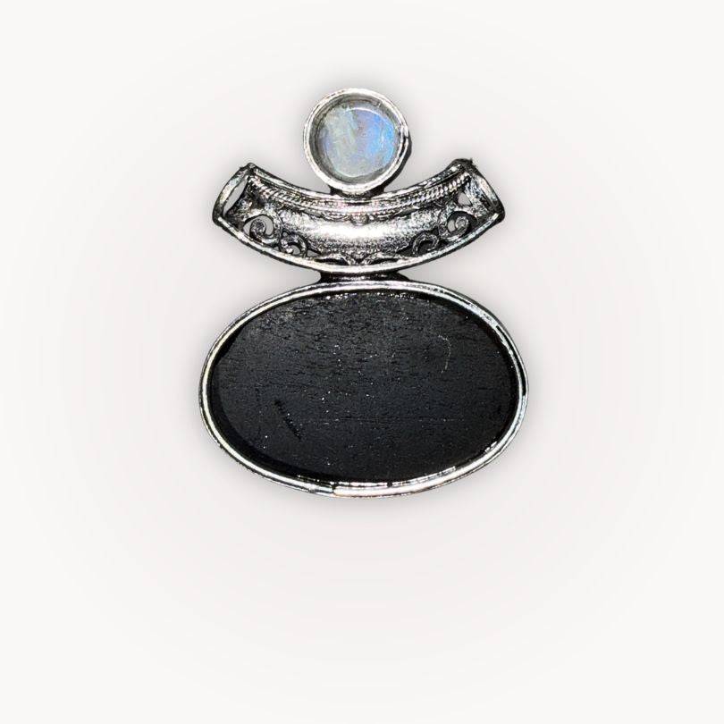 Back view of Moonstone & Black Tourmaline Pendant showing smooth Tourmaline surface and detailed silver bezel craftsmanship.