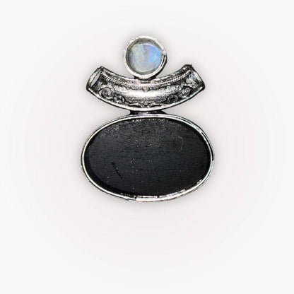 Back view of Moonstone & Black Tourmaline Pendant showing smooth Tourmaline surface and detailed silver bezel craftsmanship.