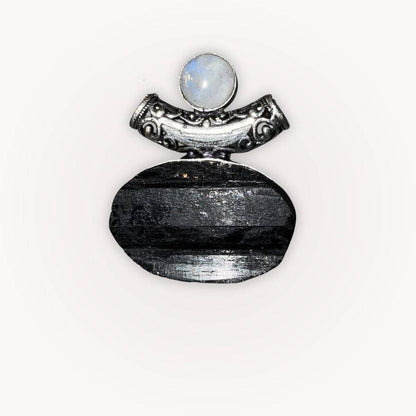 Close-up of Moonstone & Black Tourmaline Pendant featuring raw Tourmaline and polished Moonstone in ornate silver-plated bezel.