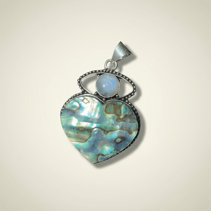 Heart-shaped abalone pendant with a moonstone accent from the Inner Compass Aligned Pairing - Intuition and Clarity Set, ideal for enhancing awareness.