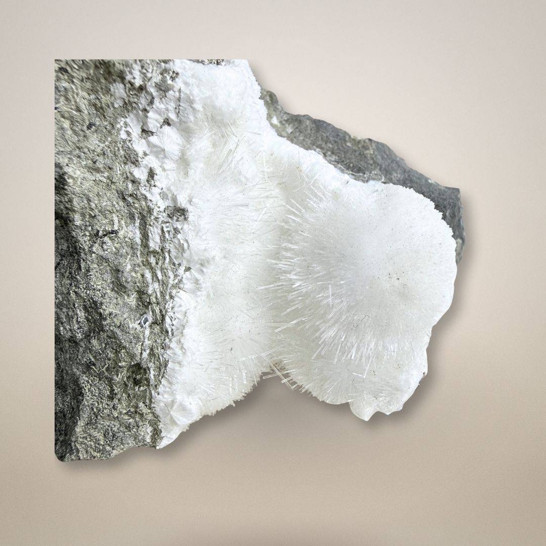 Close-up of Natrolite micro-needles showing fine acicular crystal growth on basalt, a rare zeolite mineral from Teichelberg, Germany.