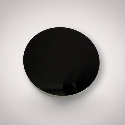 Polished black obsidian crystal grid plate 80mm back view without etching, showcasing its smooth reflective surface for grounding and decor use.