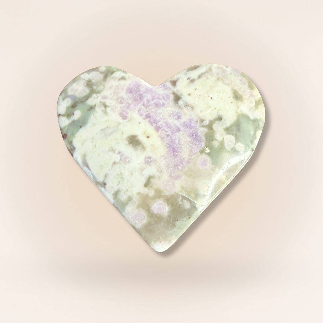 Lavender and green Peace Jade heart palm stone featuring stichtite and serpentine patterns, ideal for calming energy and compassion.