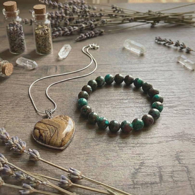 Still Point Aligned Pairing | Jasper & Chrysocolla Peace Jewelry Set displayed with dried lavender, featuring a Picture Jasper heart pendant and Chrysocolla beaded bracelet.