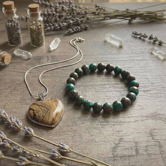 Still Point Aligned Pairing | Jasper & Chrysocolla Peace Jewelry Set displayed with dried lavender, featuring a Picture Jasper heart pendant and Chrysocolla beaded bracelet.