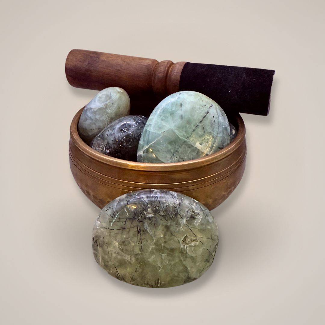 Prehnite gemstone with natural inclusions in singing bowl