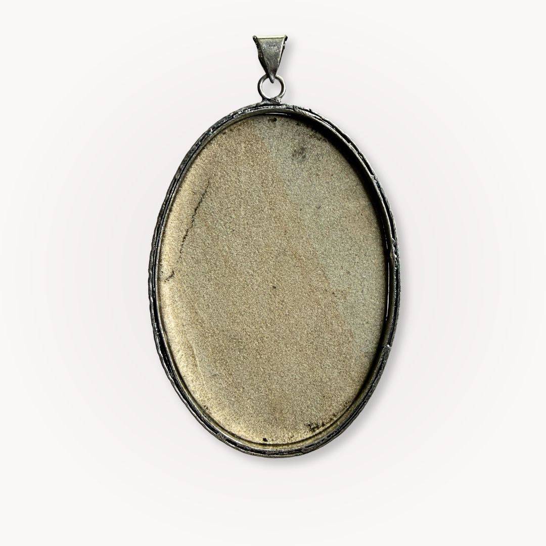 Back view of the large Psilomelane Jasper pendant showing smooth, neutral-toned stone surface. Crafted for comfort and natural elegance.