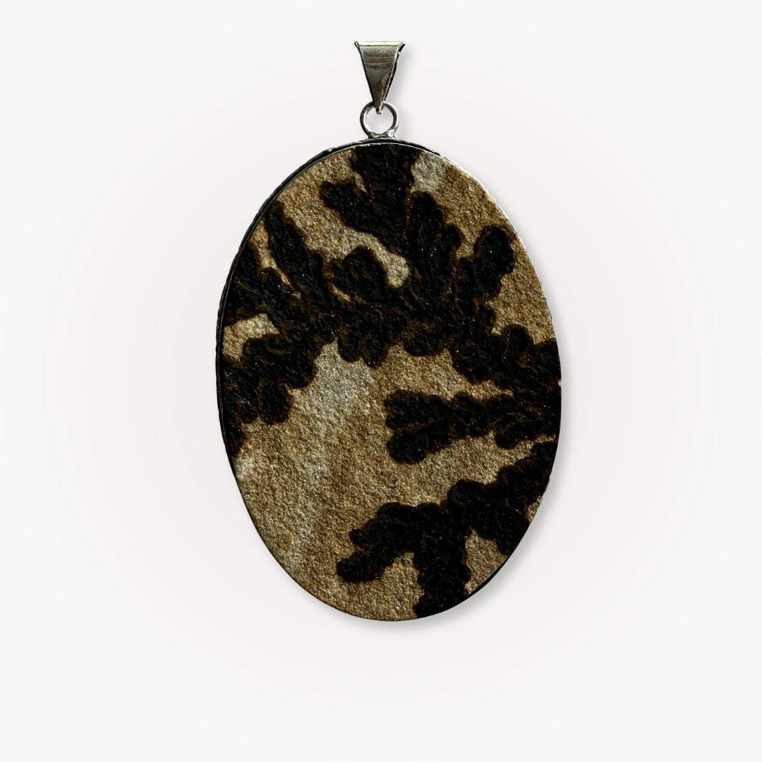 Close-up of one-of-a-kind large Psilomelane Jasper pendant featuring bold black dendritic inclusions. A grounding and protective jewelry piece.