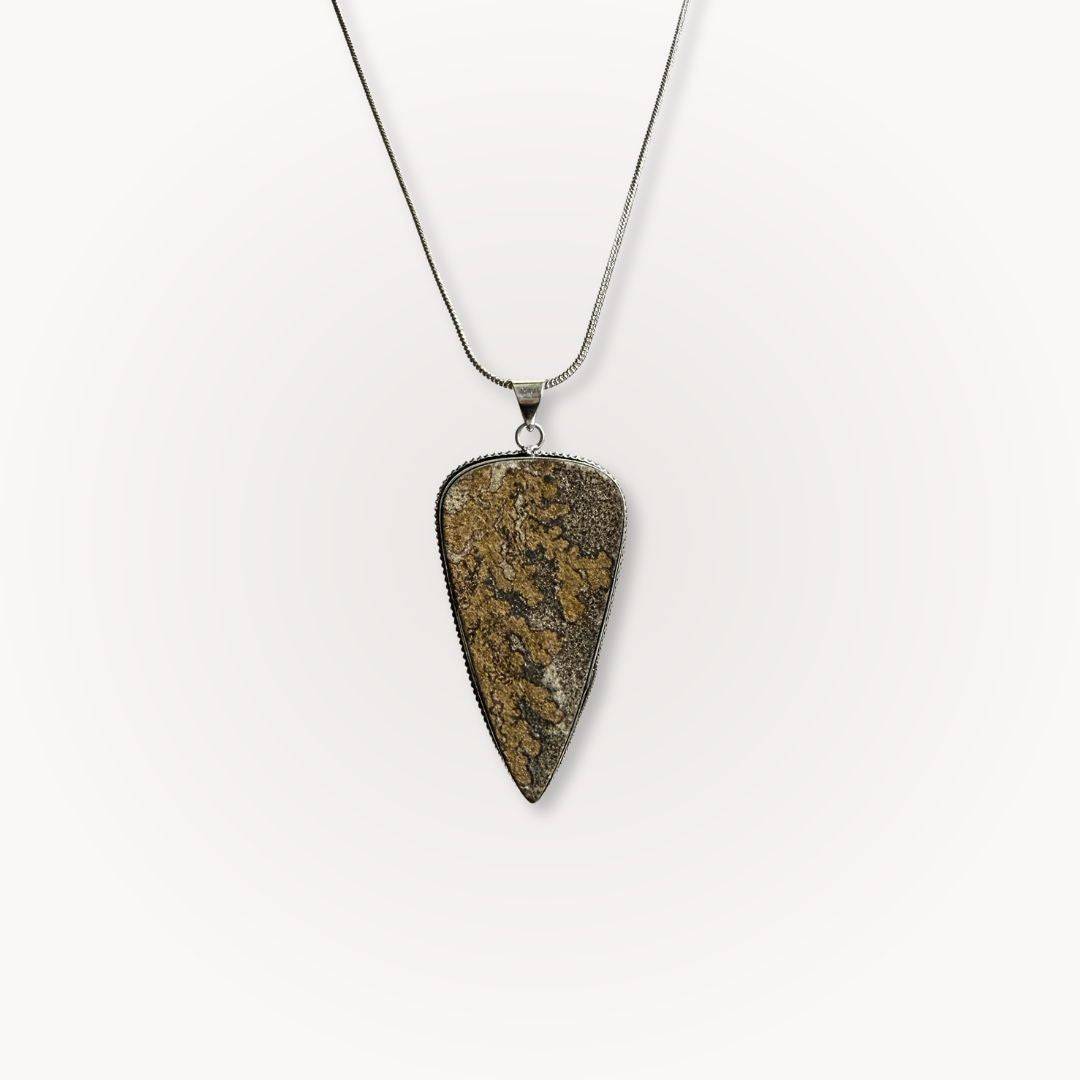 Psilomelane Jasper Pendant | Grounding, Protection, Self-awareness. Teardrop-shaped pendant with earthy brown and black patterns on a silver chain.
