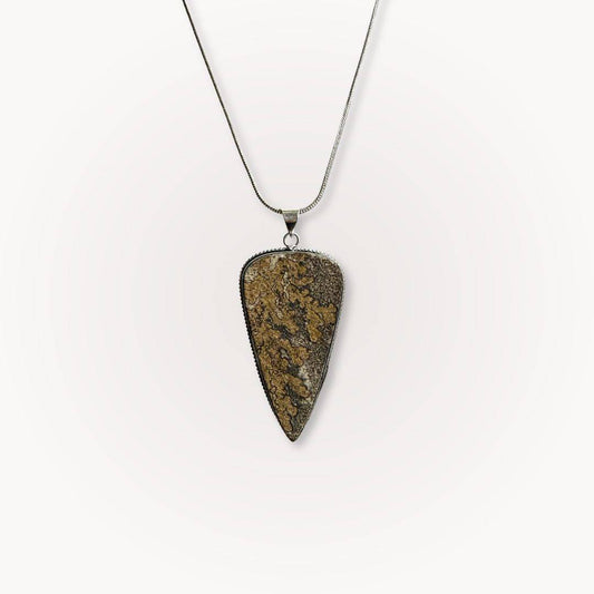 Psilomelane Jasper Pendant | Grounding, Protection, Self-awareness. Teardrop-shaped pendant with earthy brown and black patterns on a silver chain.