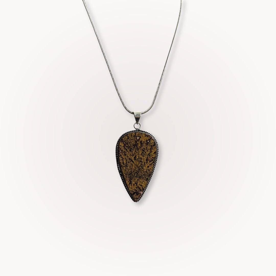 Psilomelane Jasper Pendant with teardrop shape and dendritic veining, suspended on a silver chain. Ideal for grounding and shadow work.
