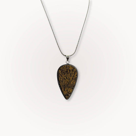 Psilomelane Jasper Pendant with teardrop shape and dendritic veining, suspended on a silver chain. Ideal for grounding and shadow work.