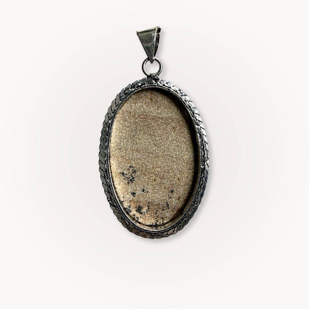 Back view of Psilomelane Jasper Pendant showing natural stone texture and handcrafted silver bezel. A unique talisman for protection.