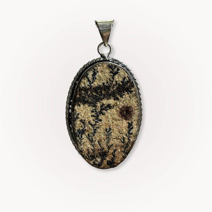 Close-up of Psilomelane Jasper Pendant featuring intricate black dendritic patterns. A powerful grounding and shadow integration charm.