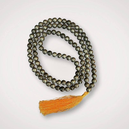 Pyrite Mala for Protection & Confidence with 108 polished beads and golden tassel, ideal for meditation and spiritual focus.