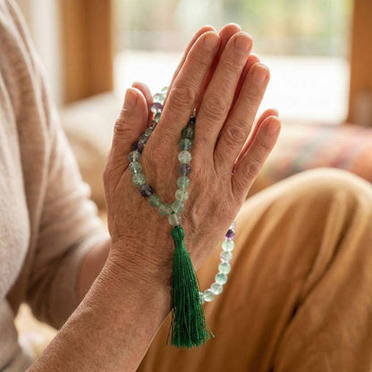 Rainbow Fluorite Mala Beads - Clarity Focus | 108 beads, 8mm held in prayer position, supporting mindfulness and clarity.