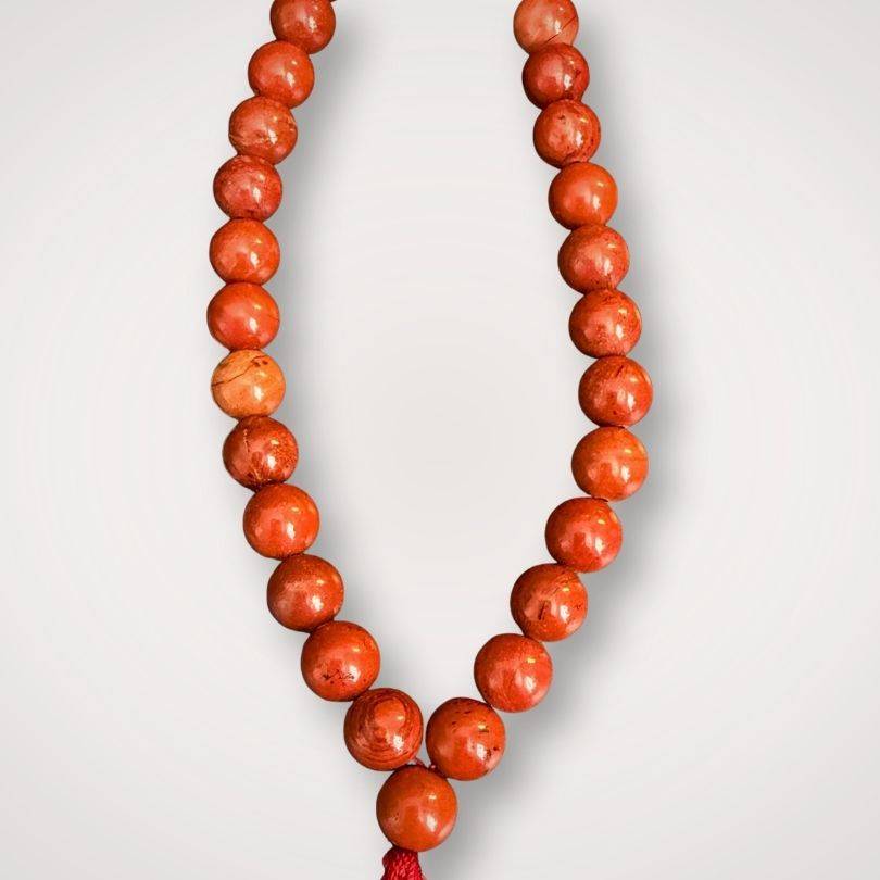 Close-up of Red Jasper Mala Necklace showing detailed polished beads and craftsmanship for spiritual grounding and strength.