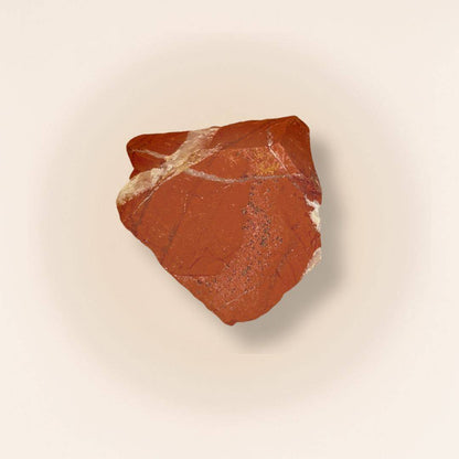 Red Jasper raw piece from Brazil with natural texture, ideal for grounding and meditation in gemstone collections or spiritual practices.