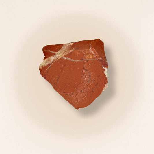 Red Jasper raw piece from Brazil with natural texture, ideal for grounding and meditation in gemstone collections or spiritual practices.