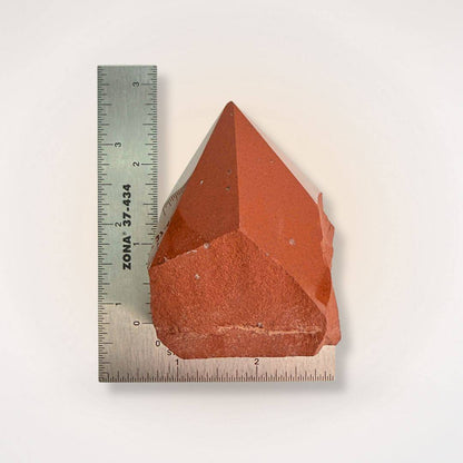 Red Jasper Top Polish Natural Sided Point tower measured against ruler, highlighting size and detail for gemstone collectors and hobbyists.