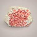Botryoidal Rhodochrosite stalactite slice with pink crystals