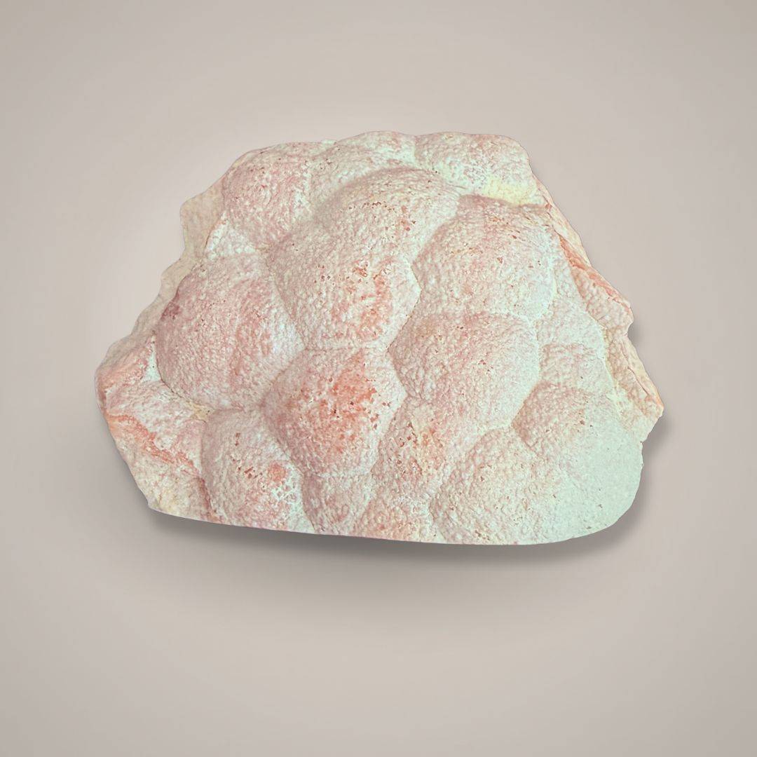 Rhodochrosite mineral specimen with size comparison cubes