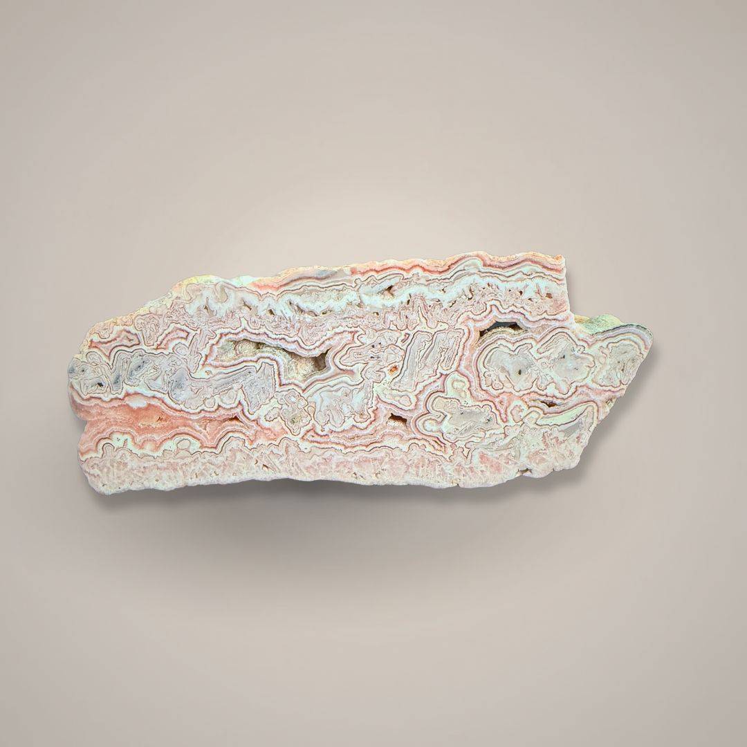 Close-up of Rhodochrosite mineral specimen showcasing colorful banded formation