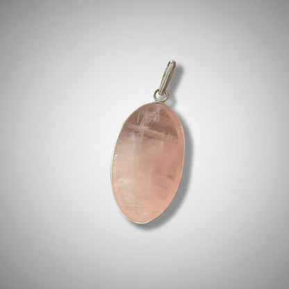Rose Quartz Oval Pendant in sterling silver setting, showcasing soft pink hues for love and healing. Ideal for emotional balance and heart chakra.