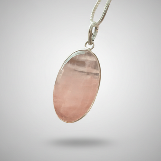 Rose Quartz Oval Pendant in sterling silver with soft pink hues, symbolizing love and healing. Ideal for emotional balance and heart chakra jewelry.