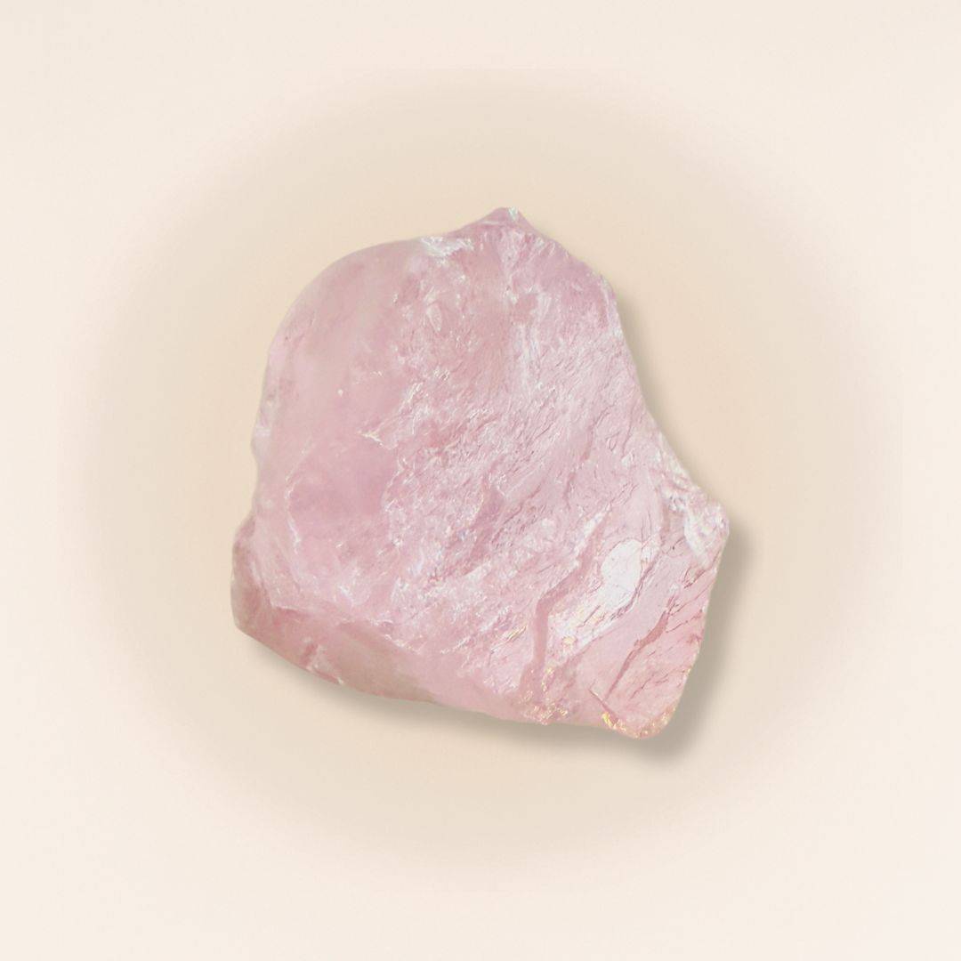 Raw Rose Quartz Crystal for heart chakra healing and self-love, featuring natural texture and soft pink hue ideal for meditation or crafting.