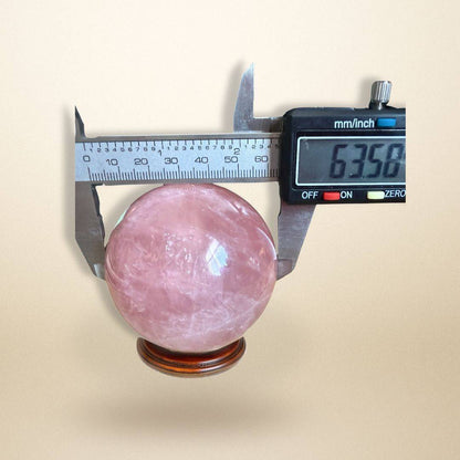 Rose Quartz Sphere 350–400g from Madagascar measured with calipers at 63.58mm, perfect for collectors and heart chakra energy work.