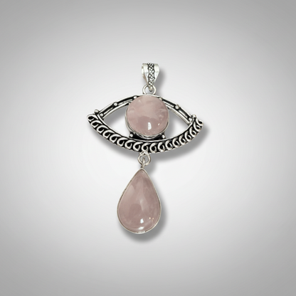 Rose Quartz Evil Eye Drop Pendant in Sterling Silver featuring a teardrop and round rose quartz stone set in an ornate eye-shaped frame. Ideal for love and protection jewelry.
