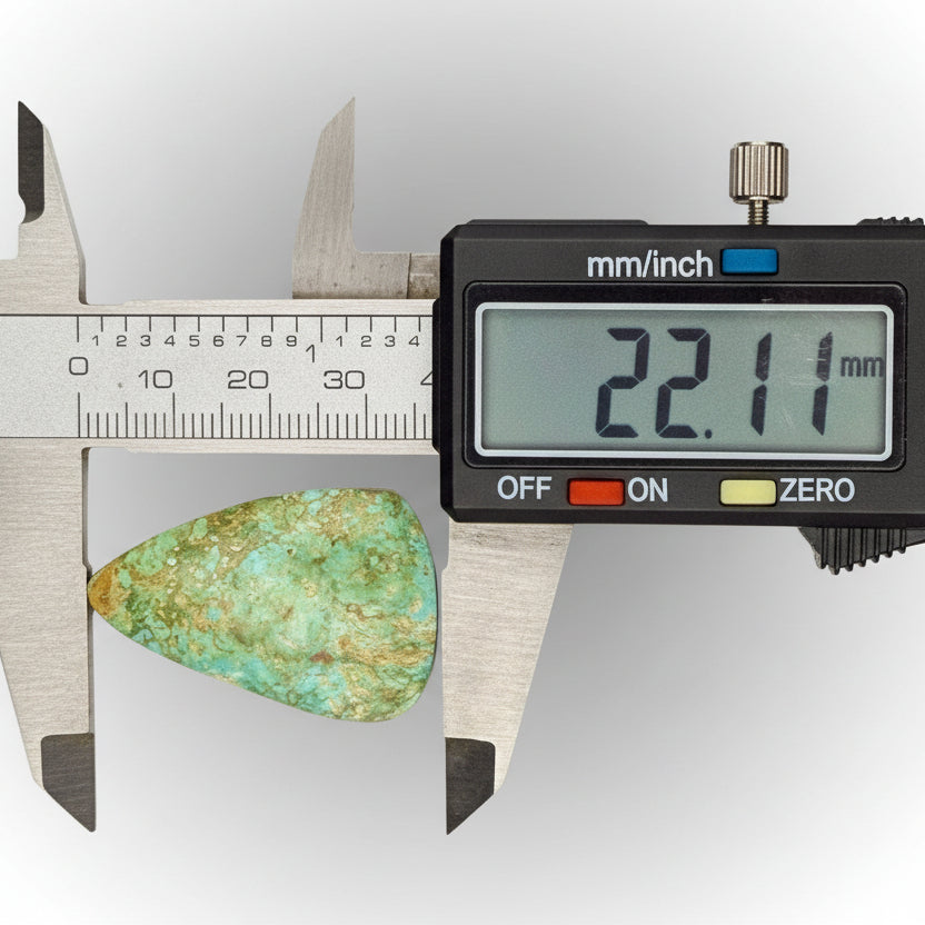 Royston Turquoise Cabochon 58.8ct measured at 22.11mm with digital caliper, showcasing green-blue hues and natural matrix from Nevada.