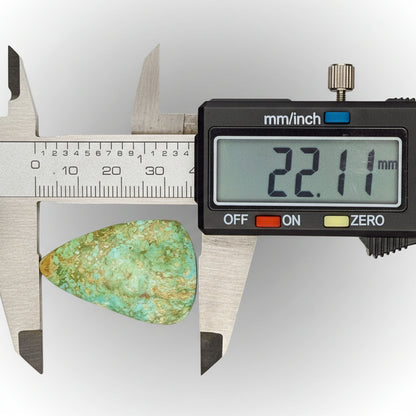 Royston Turquoise Cabochon 58.8ct measured at 22.11mm with digital caliper, showcasing green-blue hues and natural matrix from Nevada.