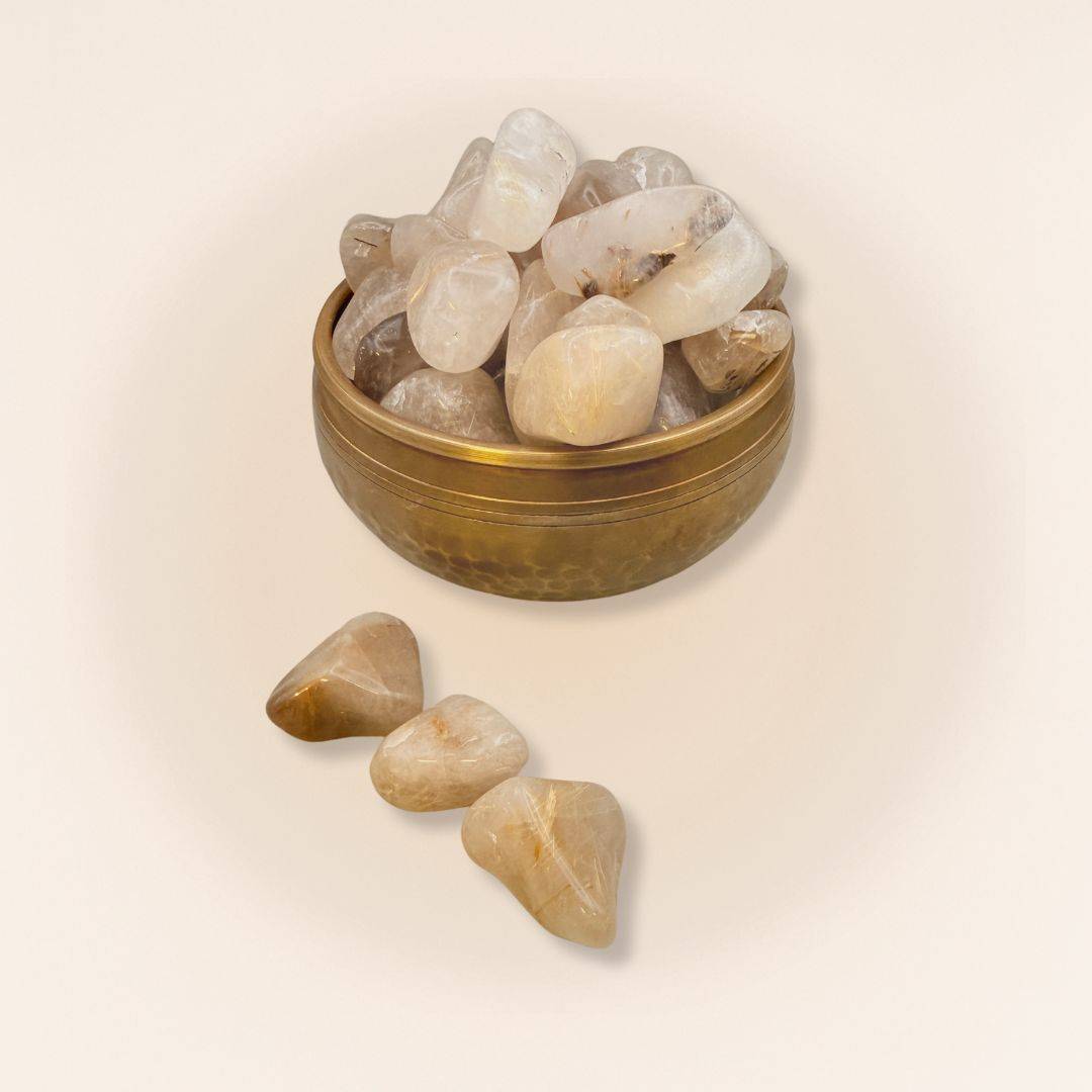 Decorative bowl filled with Rutilated Quartz Tumbled Stones (Gold Rutile), perfect for home decor and spiritual energy enhancement.