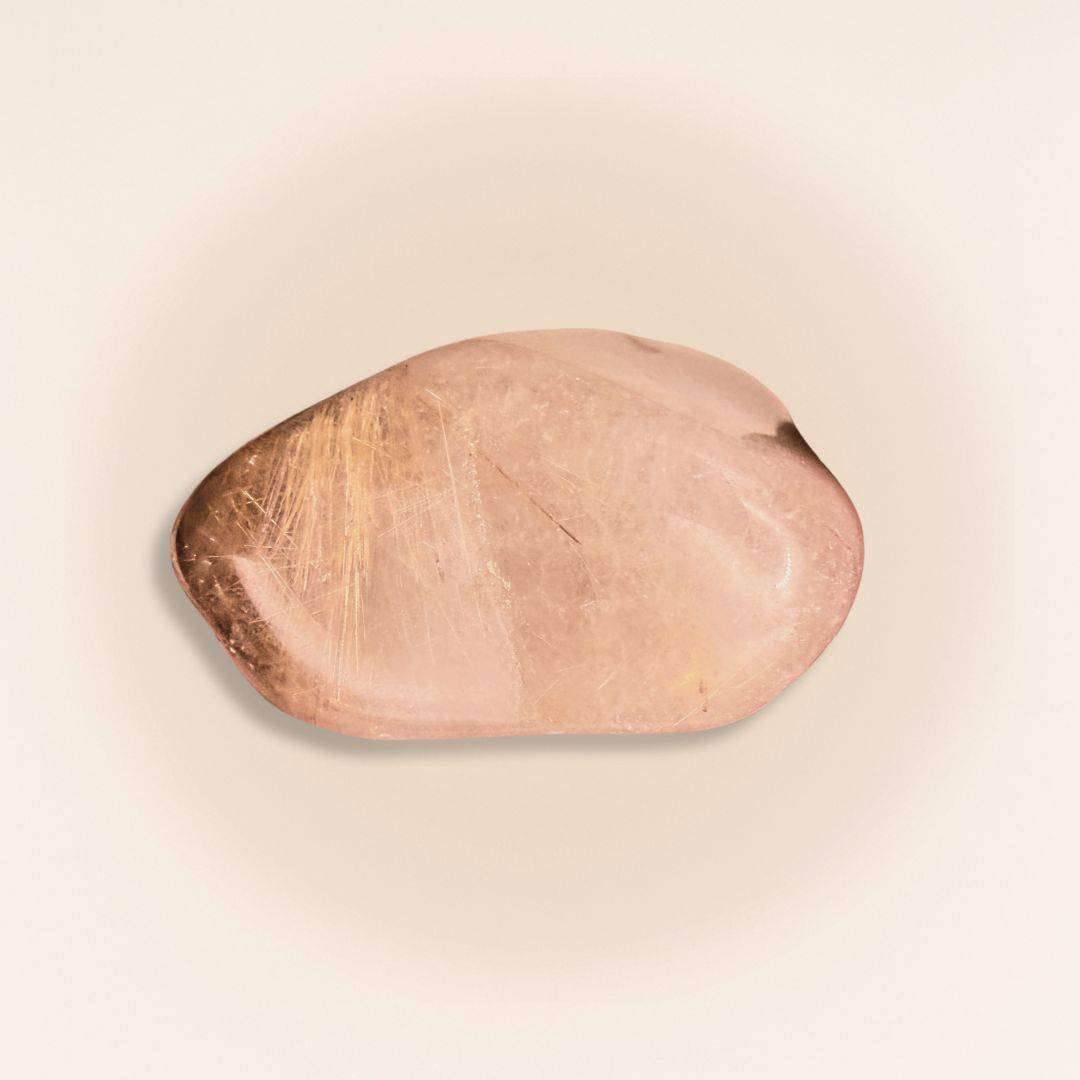 Rutilated Quartz Tumbled Stone (Gold Rutile) with visible golden needle inclusions, ideal for enhancing psychic connection and intuition.