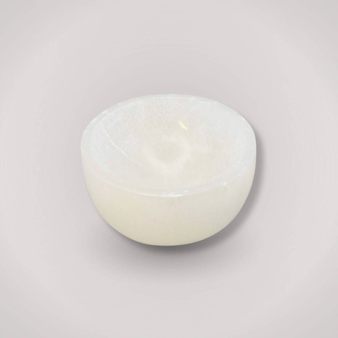Selenite Charging Bowl for ritual cleansing, hand-carved from Moroccan selenite, ideal for crystal charging and energy purification.