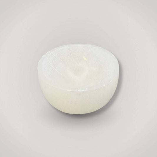 Selenite Charging Bowl for ritual cleansing, hand-carved from Moroccan selenite, ideal for crystal charging and energy purification.
