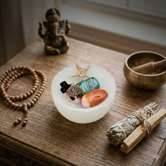 Selenite Charging Bowl displayed with crystals and spiritual tools on a wooden altar, perfect for energy cleansing and Crown Chakra alignment.