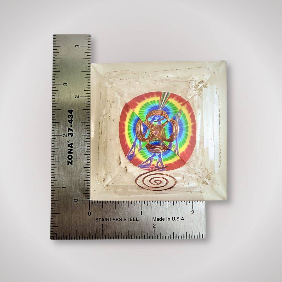 Top view of Selenite Rainbow Orgonite Pyramid with ruler for scale, showcasing its compact size and intricate copper and rainbow detailing.