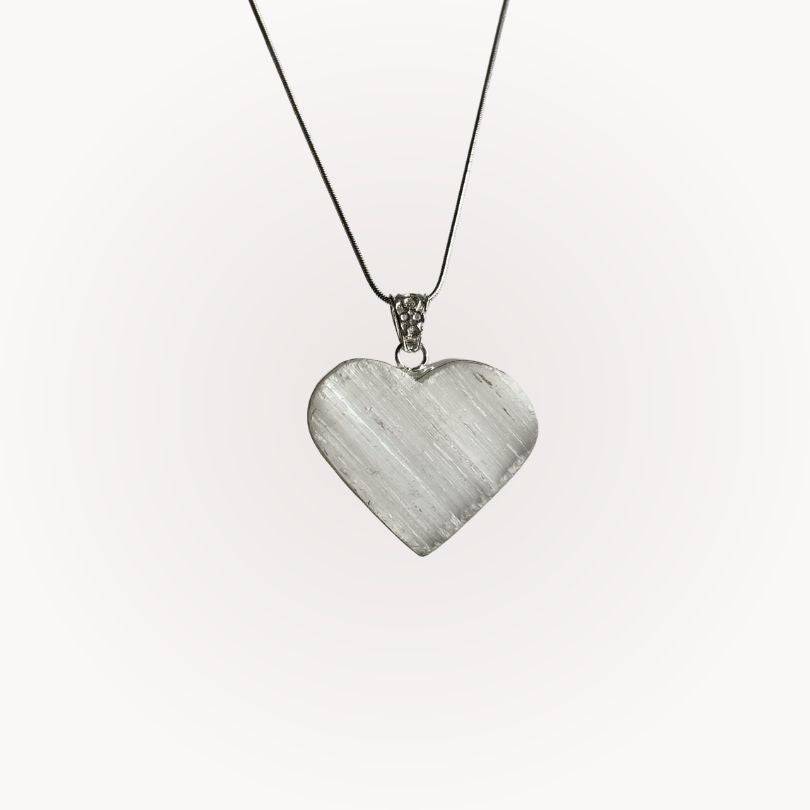 Selenite Raw Front Heart Pendant with silver-plated bezel on a thin chain, ideal for energy clearing and spiritual clarity.