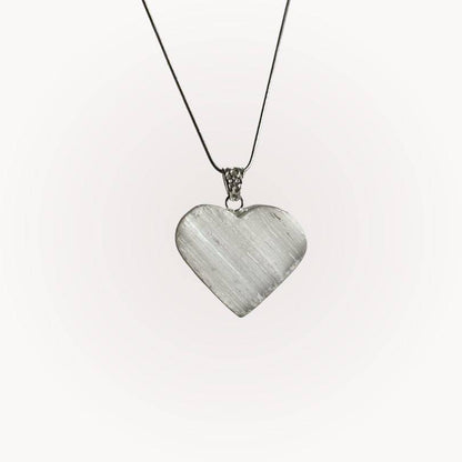 Selenite Raw Front Heart Pendant with silver-plated bezel on a thin chain, ideal for energy clearing and spiritual clarity.