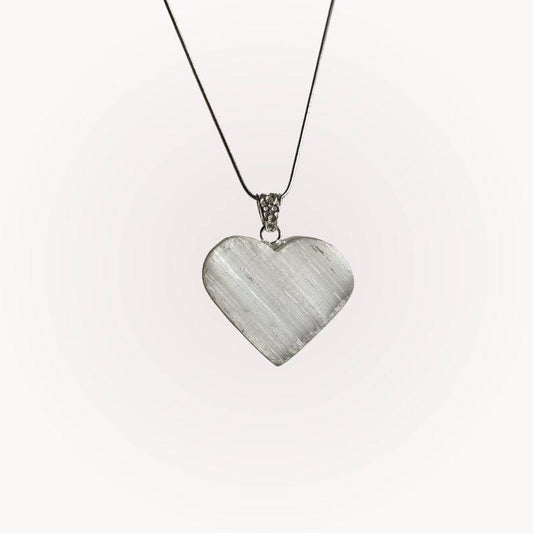 Selenite Raw Front Heart Pendant with silver-plated bezel on a thin chain, ideal for energy clearing and spiritual clarity.