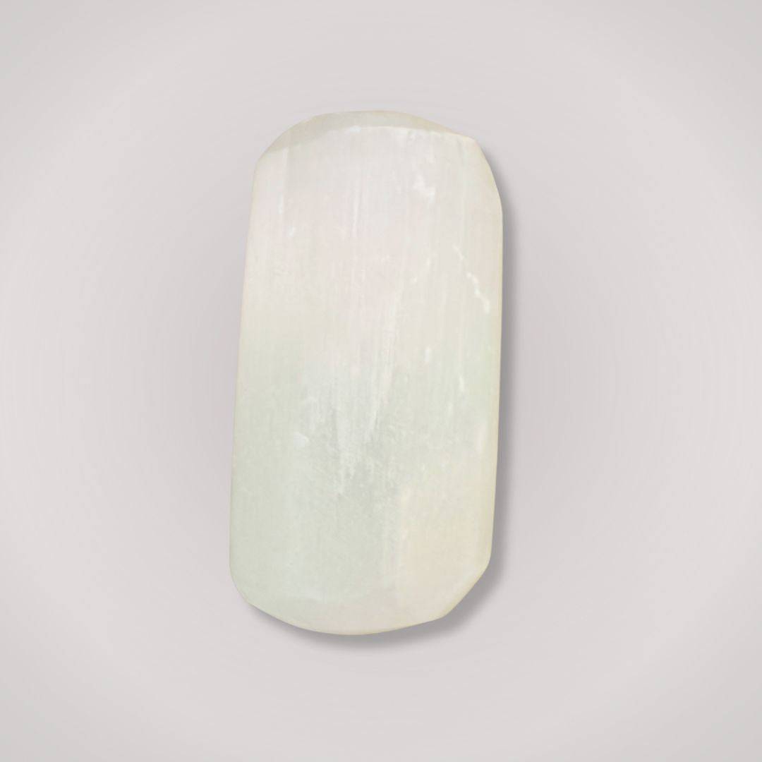 Single Selenite tumbled stone showcasing its smooth satin spar texture, ideal for clarity and energy cleansing rituals.
