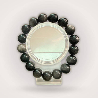 Silver Obsidian Beaded Bracelet - Protection & Clarity | 12mm round beads arranged in a circle, showcasing polished black stones with silver sheen.