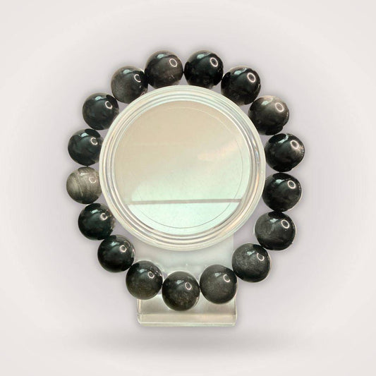 Silver Obsidian Beaded Bracelet - Protection & Clarity | 12mm round beads arranged in a circle, showcasing polished black stones with silver sheen.