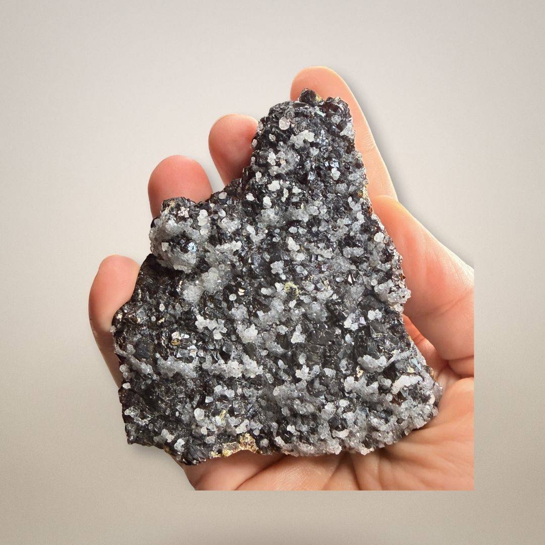 Hand holding Sphalerite Quartz specimen from Germany, showcasing its size and detailed crystal formation. A unique collector’s mineral piece.