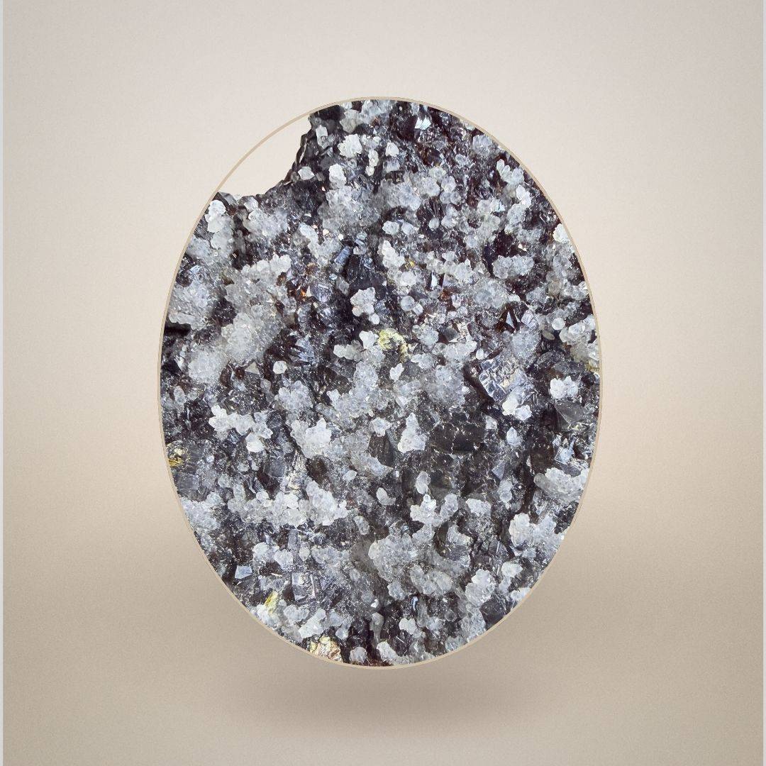 Close-up of Sphalerite with Quartz from Grube Lüderich, Germany, revealing intricate quartz crystal growth over dark sphalerite matrix.