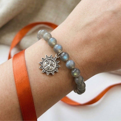 Spring Energy Box gemstone bracelet with sun charm on wrist